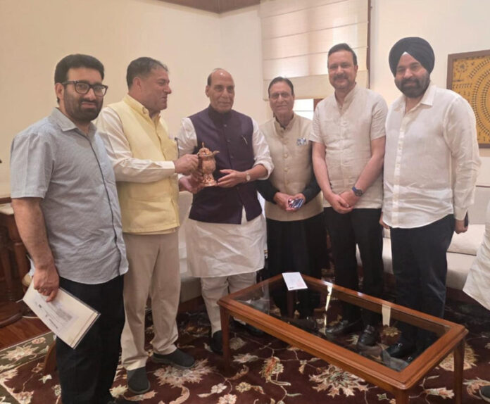 A delegation of NC MPs and MLAs posing with Defence Minister Rajnath Singh at Parliament House, New Delhi on Friday.