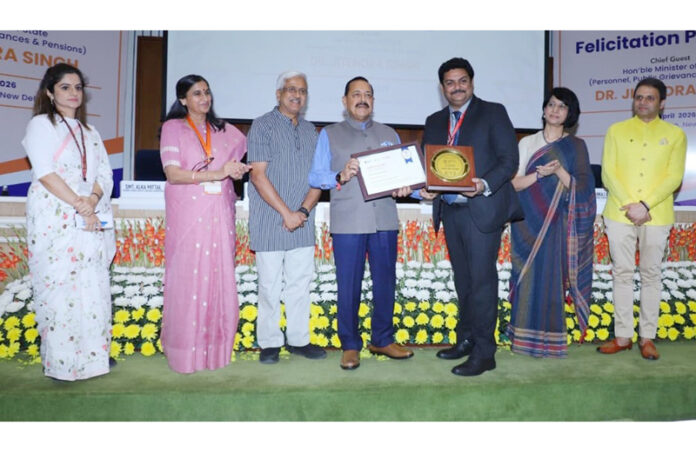 Commissioner Secretary GAD M Raju receiving an award from Union Minister Dr Jitendra Singh.