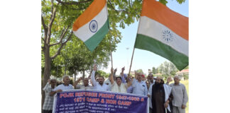POJK DPs staging protest at Maharaja Hari Singh Park in Jammu on Friday. -Excelsior/Rakesh