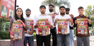 ABVP activists displaying poster of April 22 Sammelan.