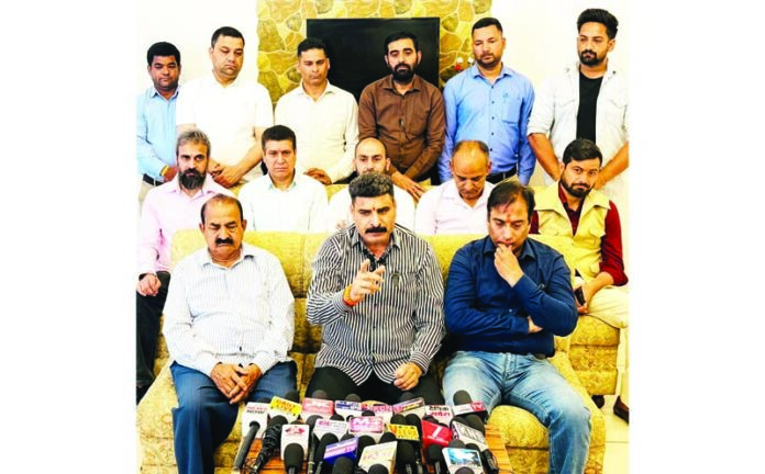 Pawan Khajuria addressing a press conference in Udhampur.