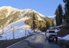 A vehicle moving on Bhaderwah-Chamba interstate road after snow clearance on Saturday. -Excelsior/Tilak Raj