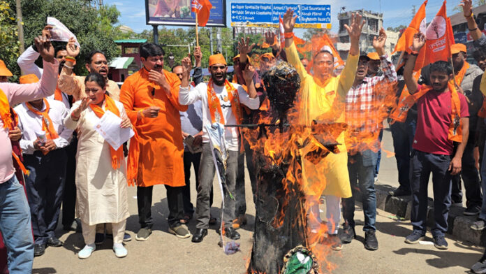 Workers of Shiv Sena torching an effigy during a protest demonstration in Jammu on Friday. Workers of Shiv Sena torching an effigy during a protest demonstration in Jammu on Friday.