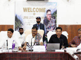 Minister Javed Rana chairing a meeting at Bhaderwah on Saturday.