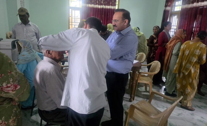 A doctor examining a patient during a medical camp at Gujroo Nagrota on Wednesday.