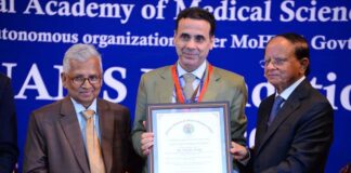SKIMS Director, Prof M. Ashraf Ganie receiving Academics Excellence Award from National Academy of Medical Sciences.
