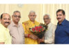 A delegation of Shiv Mandir Charitable Trust posing with LG Manoj Sinha.
