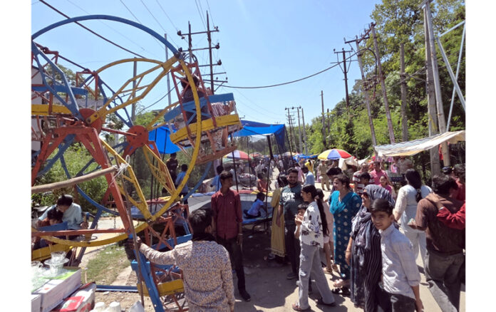 Hustle-bustle during Baisakhi Mela at Ranbir Canal in Jammu on Tuesday. — Excelsior/Rakesh Hustle-bustle during Baisakhi Mela at Ranbir Canal in Jammu on Tuesday. — Excelsior/Rakesh