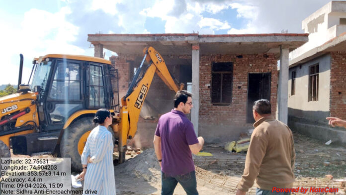 Unauthorised structure being demolished by JDA on Thursday.