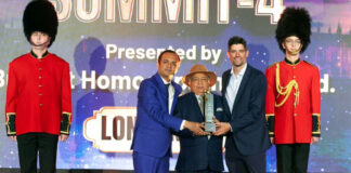 Dr Shakti Dhar Sharma receiving International Visionary Award from ex-British cricketer Alastair Cook in London.