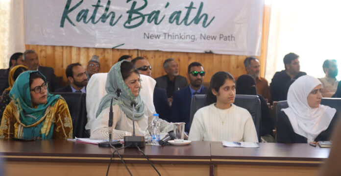 Mehbooba Mufti interacting with local residents and party workers during outreach progamme “Kaath Baat” at Baramulla on Thursday.
