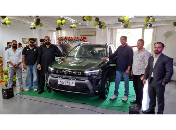Dignitaries posing for a photograph at the launch of all-new Renault Duster at a showroom in Kunjwani, Jammu.