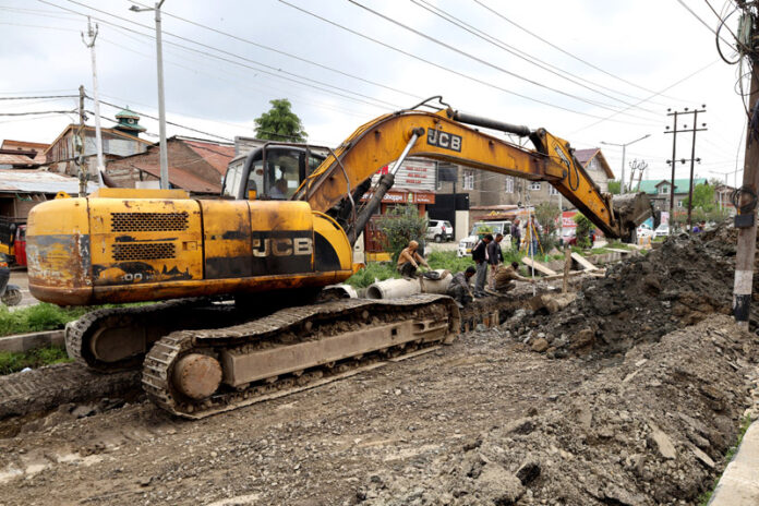 Ongoing drainage work on Srinagar's Dr Ali Jan Road in the Eidgah area on Saturday. - Excelsior/Shakeel