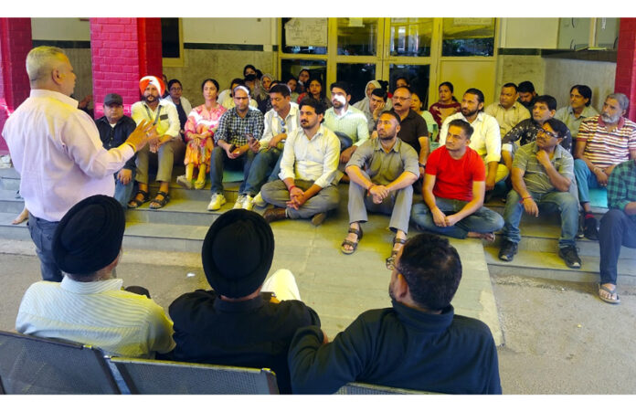 JKMEF chairman Sushil Sudan addressing protesting employees at SMGS Hospital, Jammu on Sunday.