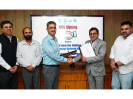 Dr Zabeer Ahmed and Khalid Jahangeer posing after signing a MoU on Tuesday.