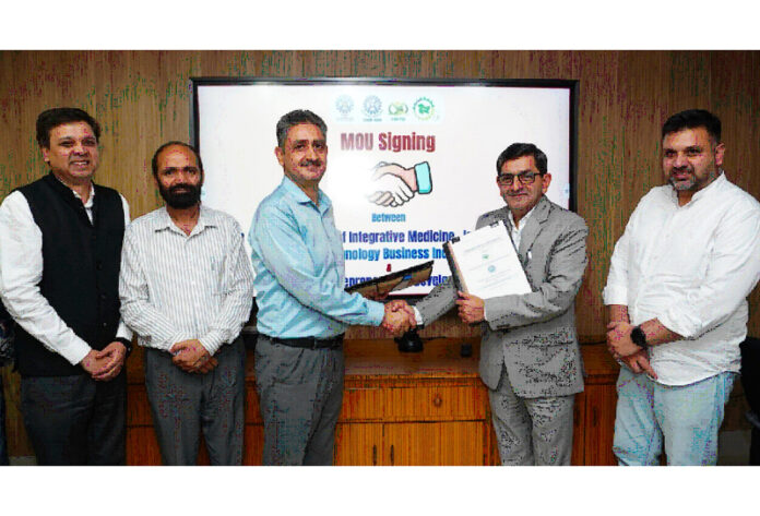 Dr Zabeer Ahmed and Khalid Jahangeer posing after signing a MoU on Tuesday.
