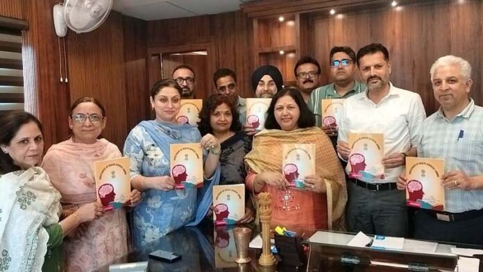 DHS Jammu Dr Abdul Hamid Zargar along with others launching a comprehensive book on mental health.