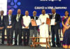 MoU signing between IIM Jammu and CAHO during CAHO's annual conference, in the presence of M Venkaiah Naidu and others.