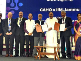 MoU signing between IIM Jammu and CAHO during CAHO's annual conference, in the presence of M Venkaiah Naidu and others.