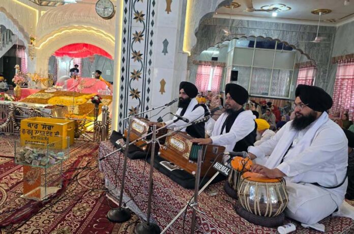 Ragi Jatha chanting religious discourse during a function at Gurdwara Guru Nanak Dev Ji at Chand Nagar in Jammu.