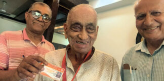 Justice (Retd) K K Gupta posing along with his biradari voter card.