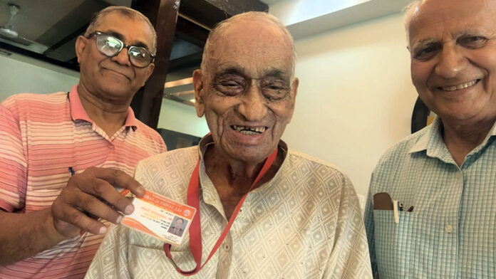 Justice (Retd) K K Gupta posing along with his biradari voter card.