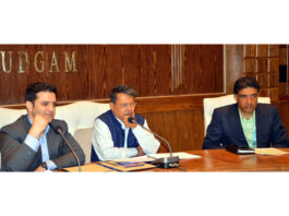 SEC Shantmanu chairing a meeting at Budgam on Saturday.