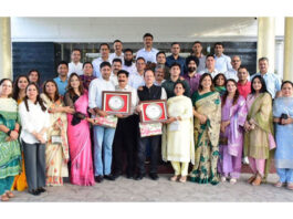 Senior officers of Civil, Police and Accounts Services posing with JKAS officers Naresh Kumar and Kartar Singh during a farewell party at Jammu.