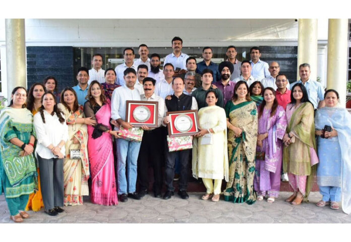 Senior officers of Civil, Police and Accounts Services posing with JKAS officers Naresh Kumar and Kartar Singh during a farewell party at Jammu.