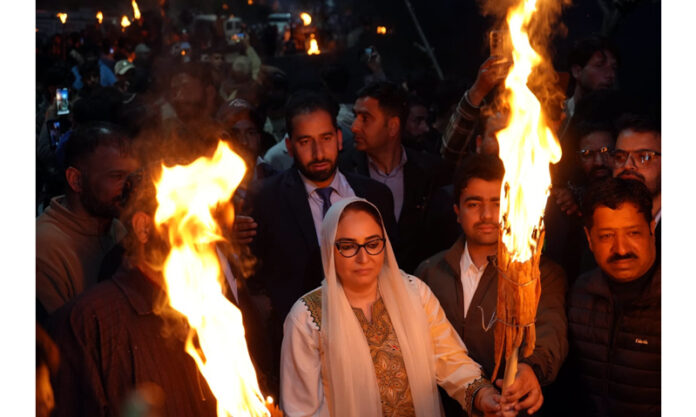 Chairperson of the J&K Waqf Board, Dr Syed Darakhshan Andrabi, paying obeisance at Aishmuqam shrine in Pahalgam.