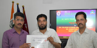 Deputy Director, SKPA Udhampur, Rajesh Sharma, presenting certificate to a participant of CCTNS course.