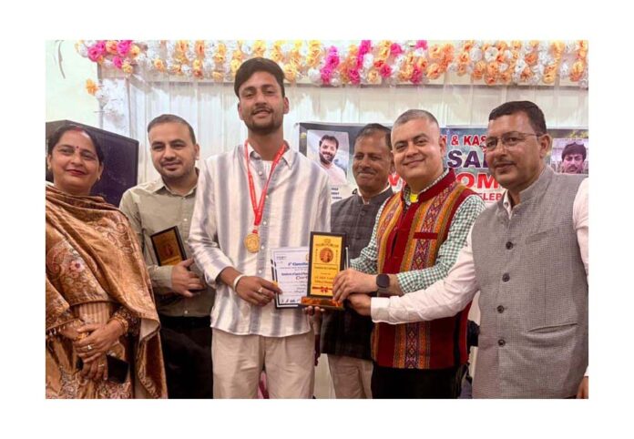 Amit Sharma honouring top achievers of the Gaddi/Sippi community during a function in Udhampur.