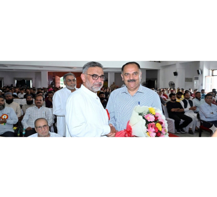 A dignitary being greeted with a flower bouquet during a conference at Gurjar Desh Charitable Trust in Jammu on Saturday.