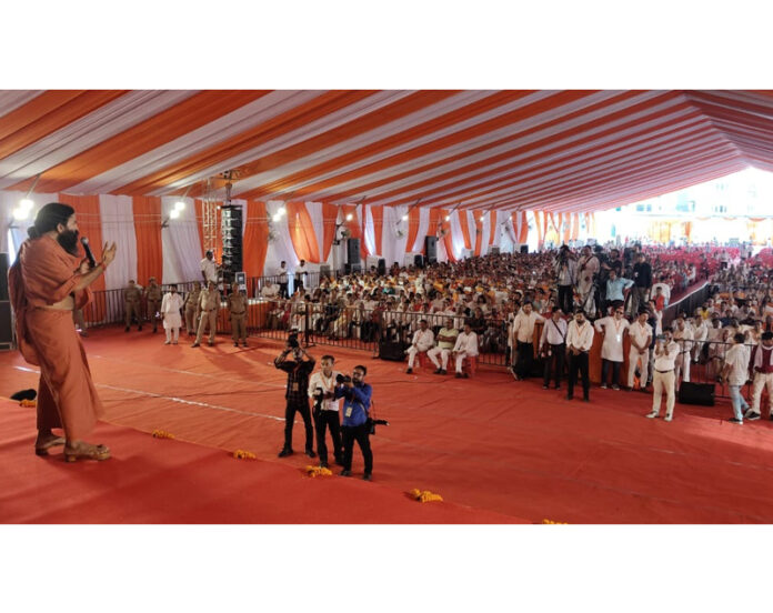 Swami Ramdev of Patanjali Yogpeeth addressing a gathering during an event in Lucknow on Tuesday.