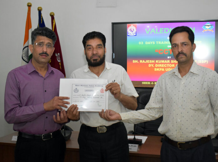 Deputy Director, SKPA Udhampur, Rajesh Sharma, presenting certificate to a participant of CCTNS course.