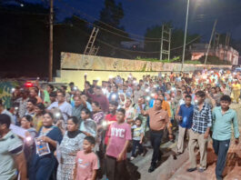 Locals carrying out a candle march at Bahu Fort area in Jammu on Tuesday.