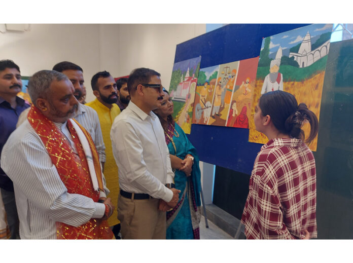 Dignitaries during a painting exhibition at Kala Kendra, Jammu on Friday.