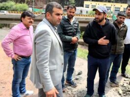DC Ramban Alyas Khan inspecting road clearance operation.