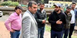 DC Ramban Alyas Khan inspecting road clearance operation.