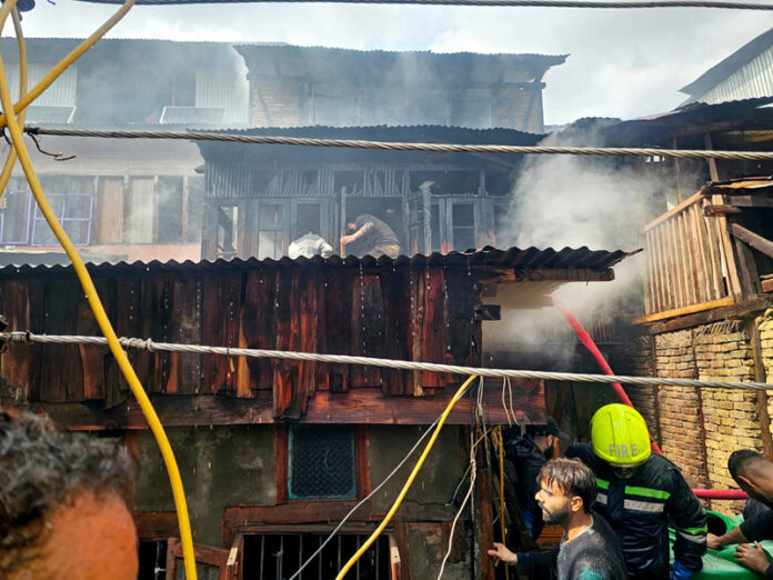 View of a house damaged in a fire in Habba Kadal area of Srinagar on Tuesday. -Excelsior/Shakeel