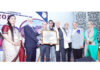 Principal GMC Jammu Dr Ashutosh Gupta along with other dignitaries presenting an award to a senior doctor during a conference.