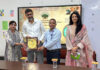 Resource person being presented memento during guest lecture at CUJ.