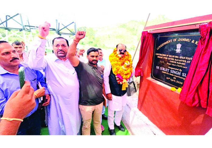 MLA Samba, Surjit Singh Salathia inaugurating suspension bridge at Samotha on Monday.