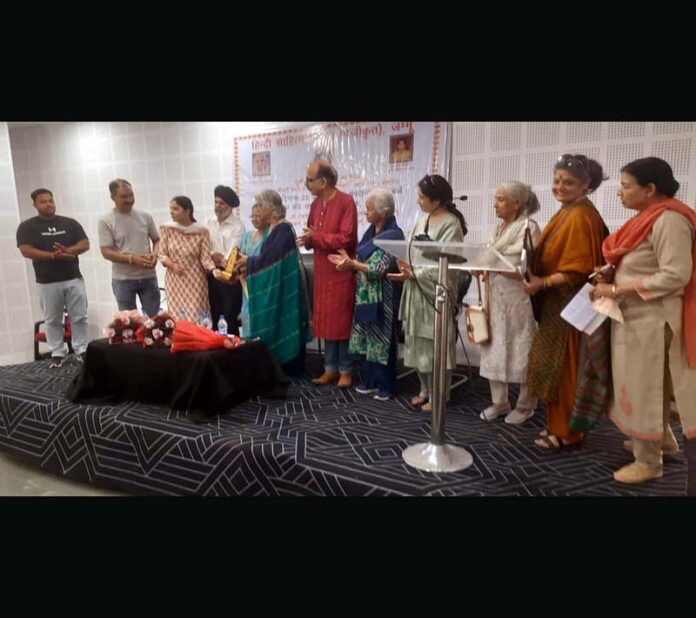 Vinshika Jamwal receiving award during function by Hindi Sahitya Mandal on Thursday.