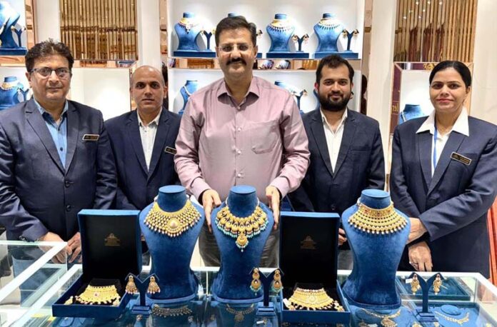 Anil Chouhan, MD of R K Chouhan Jewellers launching new collection in Jammu. Anil Chouhan, MD of R K Chouhan Jewellers launching new collection in Jammu.