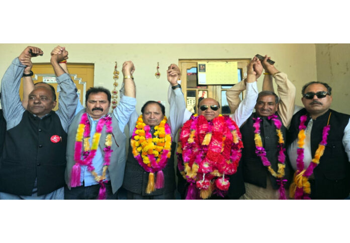 Rattan Lal Gupta, provincial president of JKNC posing along with others in Kathua.