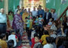 Members of Ram Trust posing along with students in Jammu.