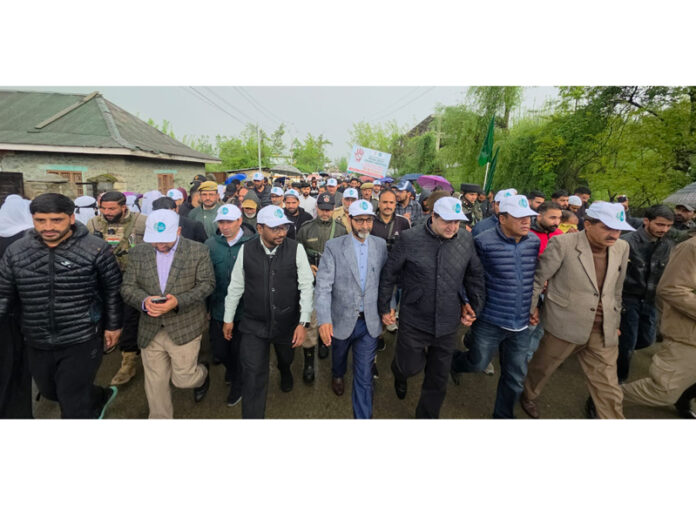 A large number of people participating in the Pad Yatra in Kupwara on Friday.
