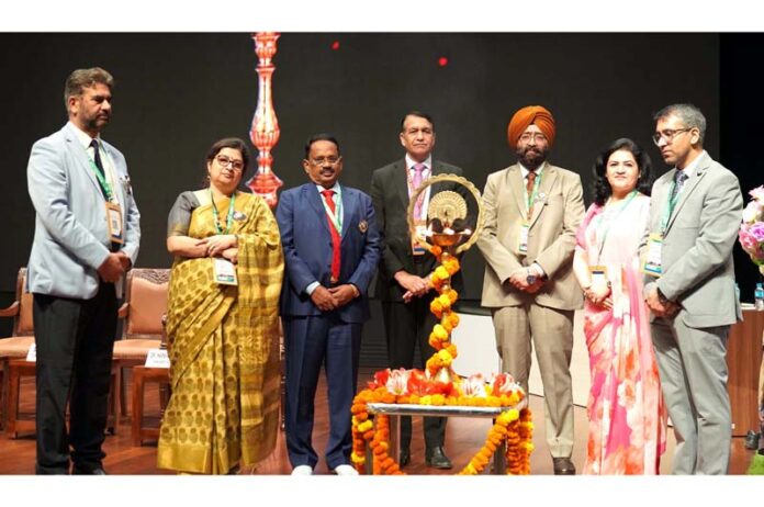 Dignitaries gather for the traditional lamp lighting ceremony at AIIMS Jammu during the JAKASICON 2026 Conference on Tuesday.
