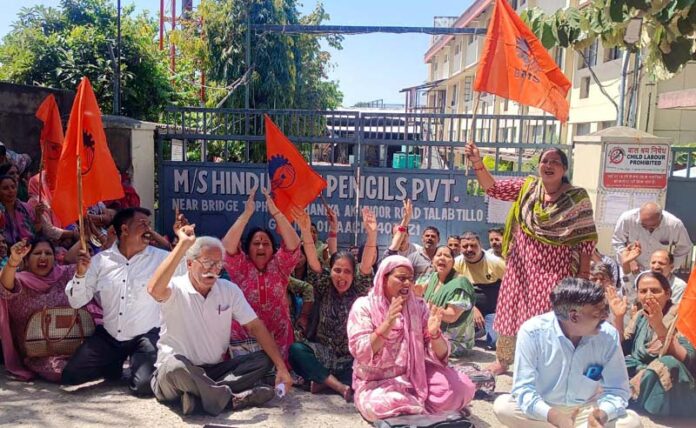 Workers of Hindustan Pencils Pvt Ltd raising slogans during a protest in Jammu on Wednesday.